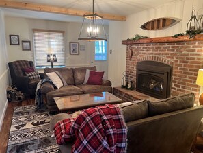 Smart TV, fireplace, table football, books