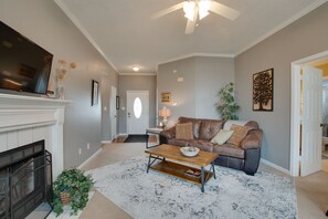 TV, fireplace, books