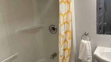 Combined shower/bathtub, hair dryer, towels, soap