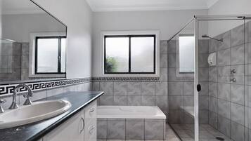 Bathtub, hair dryer, towels, soap