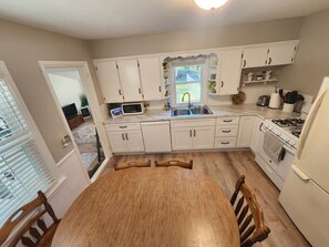 Fridge, microwave, oven, stovetop - Cozy Neutral Farmhouse Welcomes Peaceful Retreat (Muskegon)