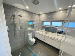 Grand House | Bathroom | Shower, rainfall showerhead, towels, soap