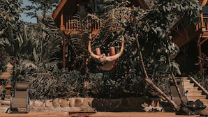 A wooden building with a pool in front. - Kusfarm Bali by AHM (Selemadeg)