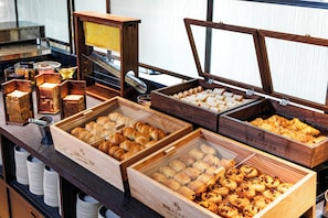 Enjoy a delicious breakfast spread with an assortment of freshly baked pastries and sweet treats.