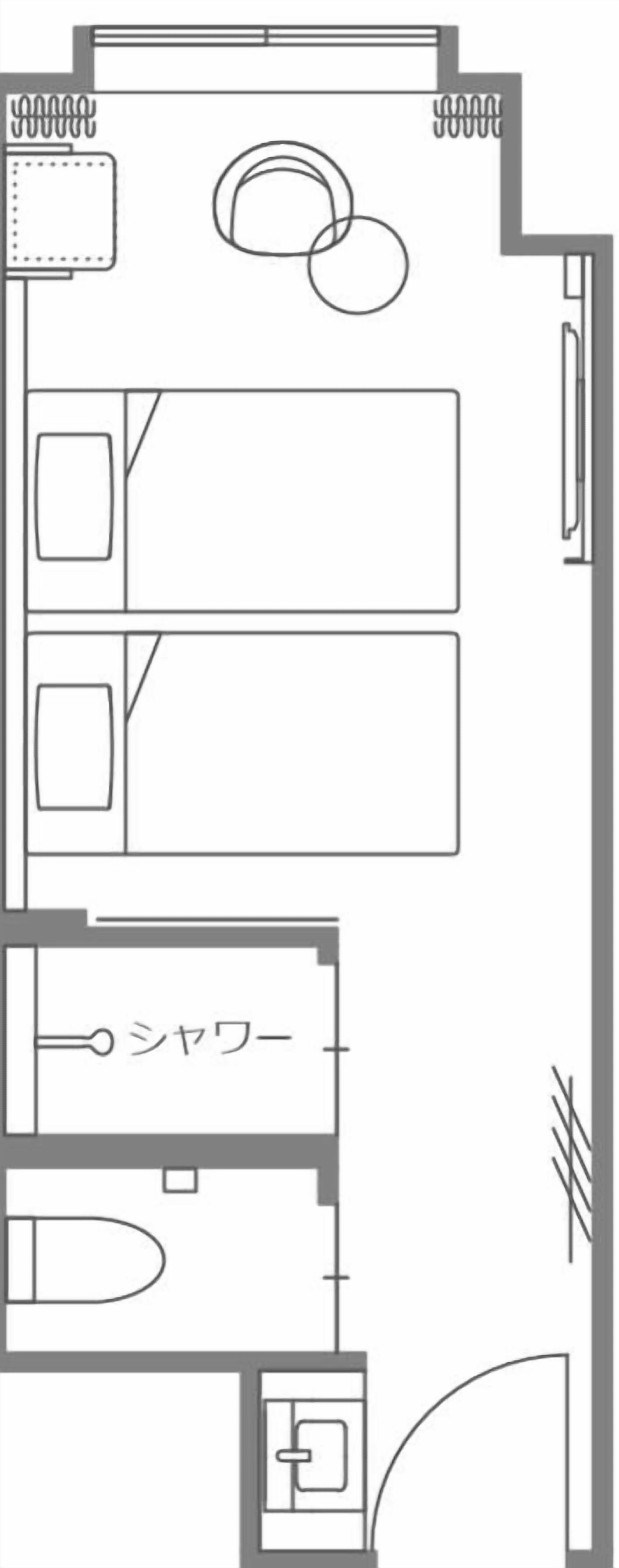 A hotel floor plan with multiple rooms, a bathroom, and a kitchenette area.