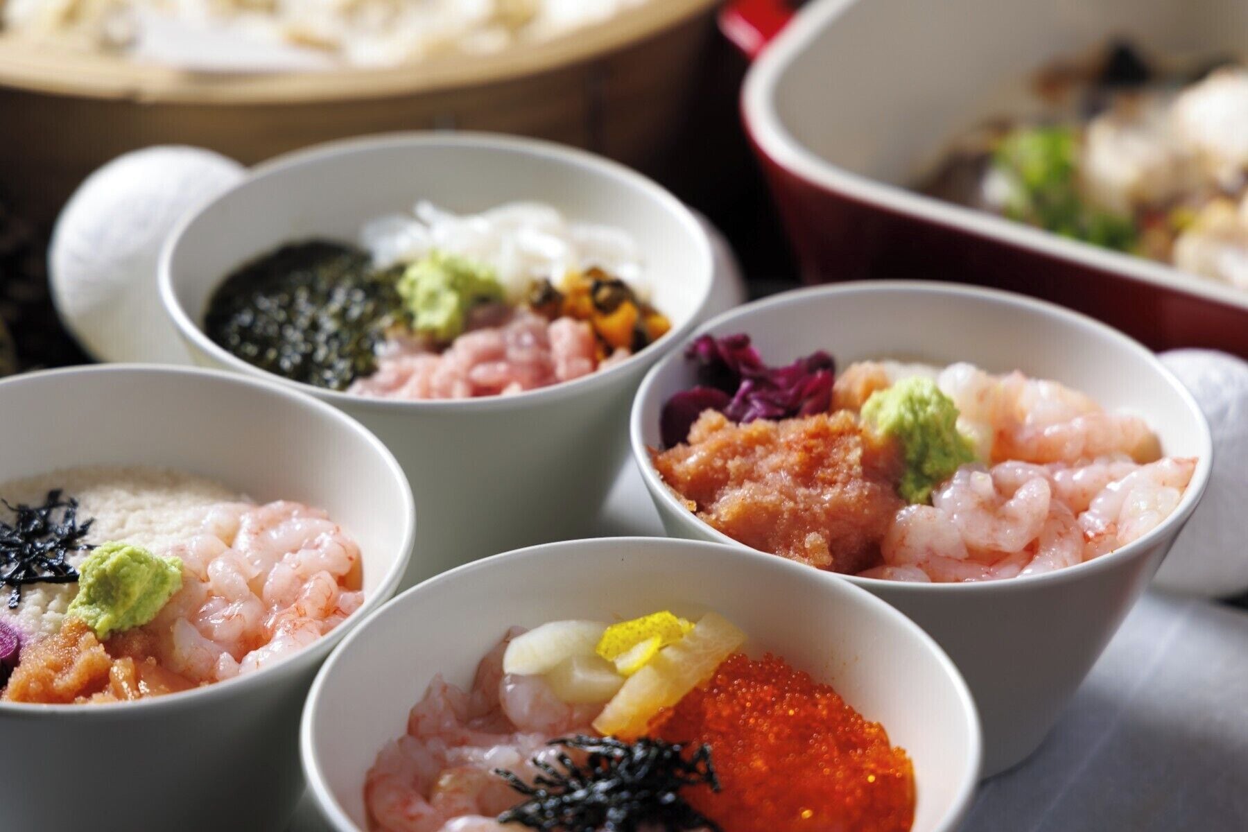 A variety of sushi dishes in bowls.