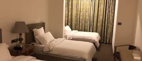 Deluxe Triple Room, Non Smoking, Courtyard View | 1 bedroom, premium bedding, minibar, individually decorated