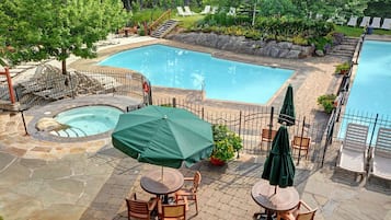 Seasonal outdoor pool, open 10:00 AM to 10:00 PM, pool umbrellas