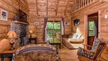 40-inch TV with cable channels, fireplace