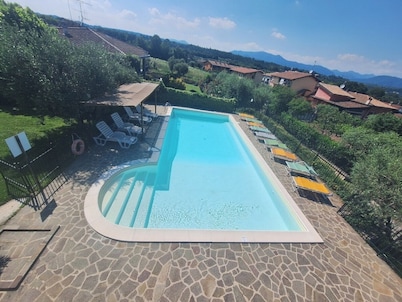 Apartment 6 with patio, pool, soccer field and gated parking lot