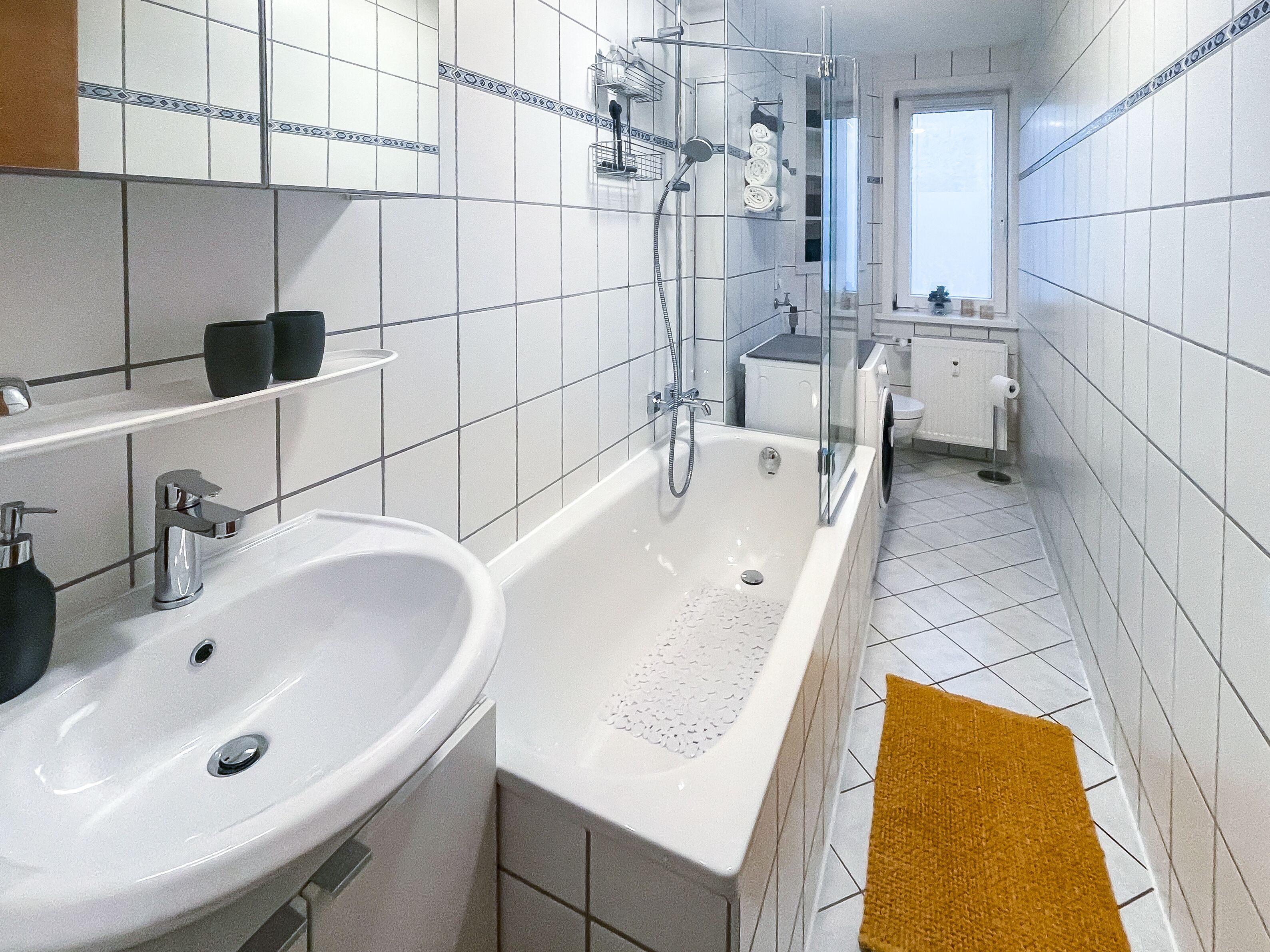 Combined shower/tub, hair dryer, towels, soap