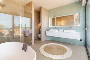 Bathtub, hair dryer, towels, soap