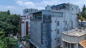 A hotel with a prominent sign reading "Tetrad Hotel". - Tetrad Hotel - International Airport Road Hebbal (Bengaluru)