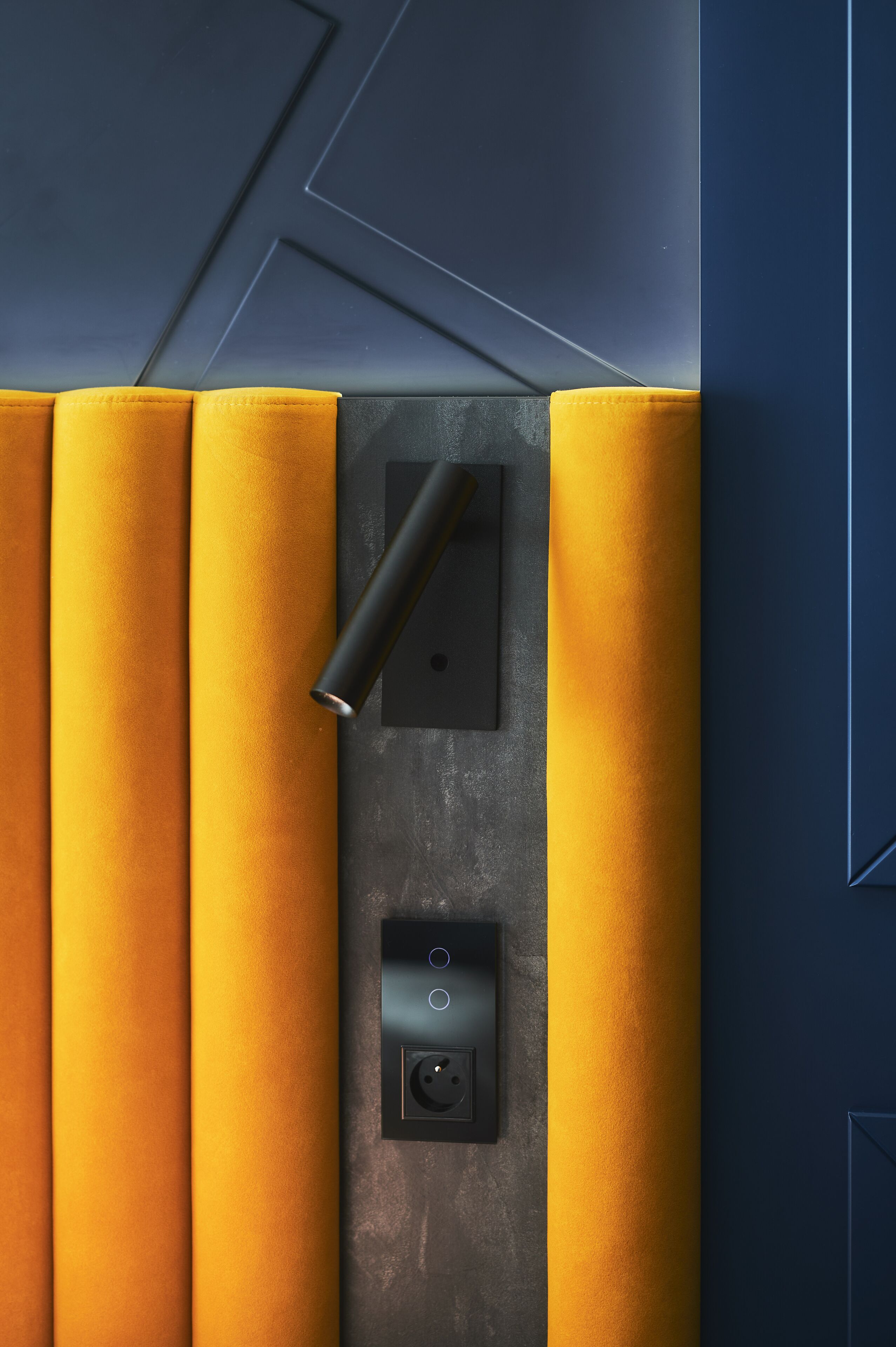 A modern elevator with a metallic finish and a control panel.