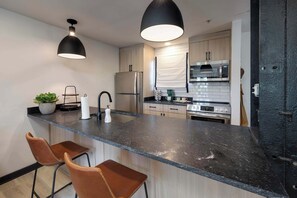 Fridge, microwave, oven, stovetop - River-View Downtown Condo · Pool · Near Broadway (Nashville)