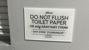 A sign on a wall that reads "DO NOT FLUSH TOILET PAPER OR any SANITARY ITEMS. NOT EVEN 'FLUSHABLES' THANK YOU." - 1 bedroom 1 bath private entrance (Bay Shore)