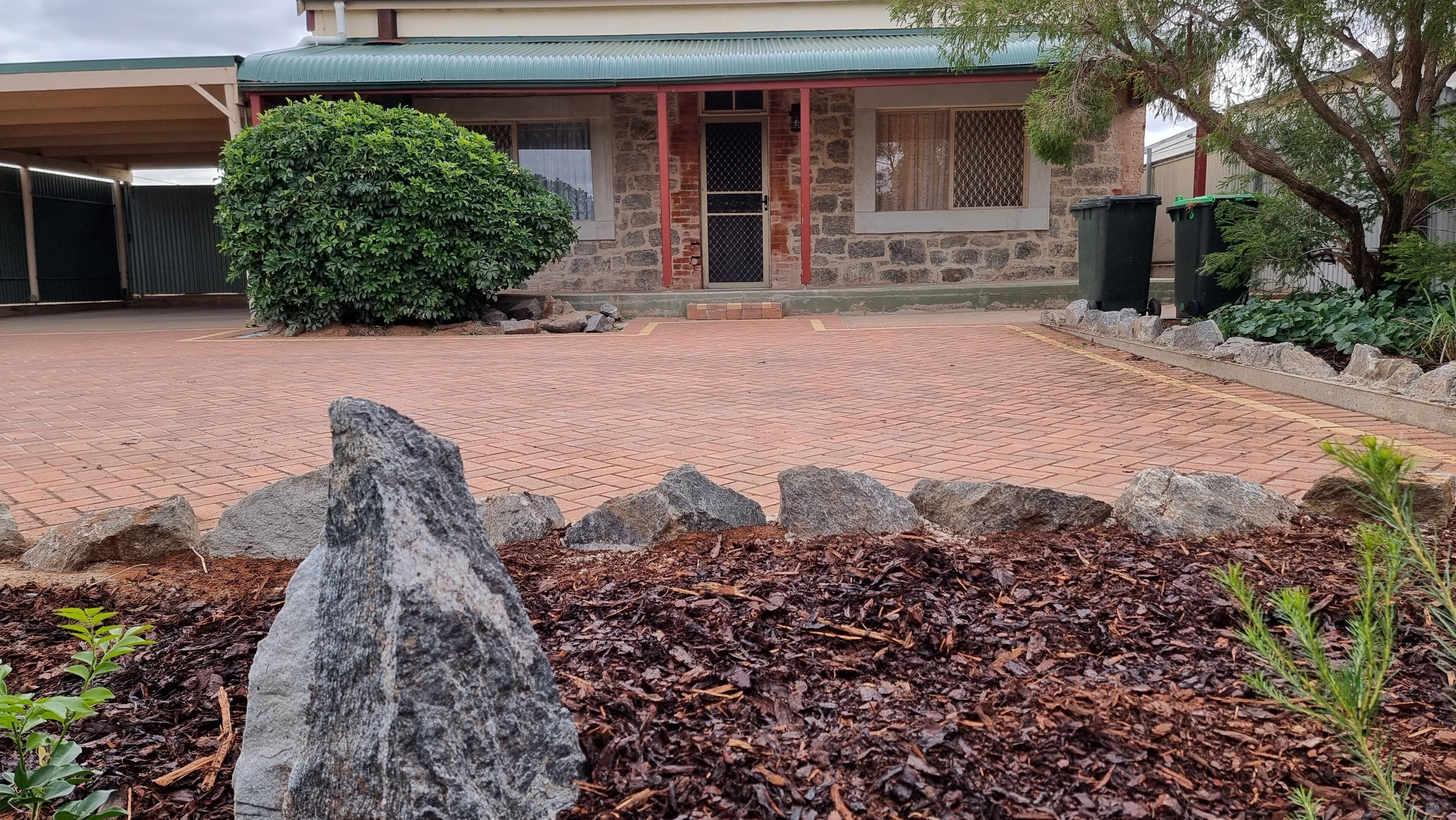 Paved front yard, ample parking.
