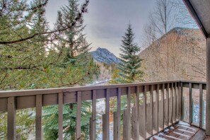 Enjoy breathtaking views of the surrounding mountains from this balcony.