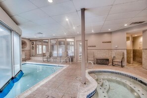 Relax by the pool surrounded by a spacious deck and comfortable seating areas.