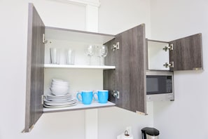 Mini-fridge, microwave, cookware/dishes/utensils, paper towels - Maverick Suites at 89 Marion (Brookline)