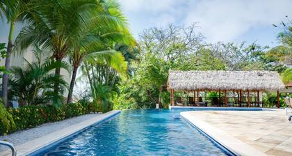 Fabulous ocean-view apartment with balcony, pool, grill, & full kitchen