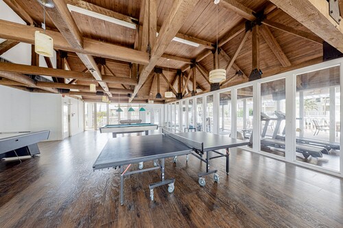 Gulf-view condo with balcony & on-site pool/hot tub/tennis/gym/game room access