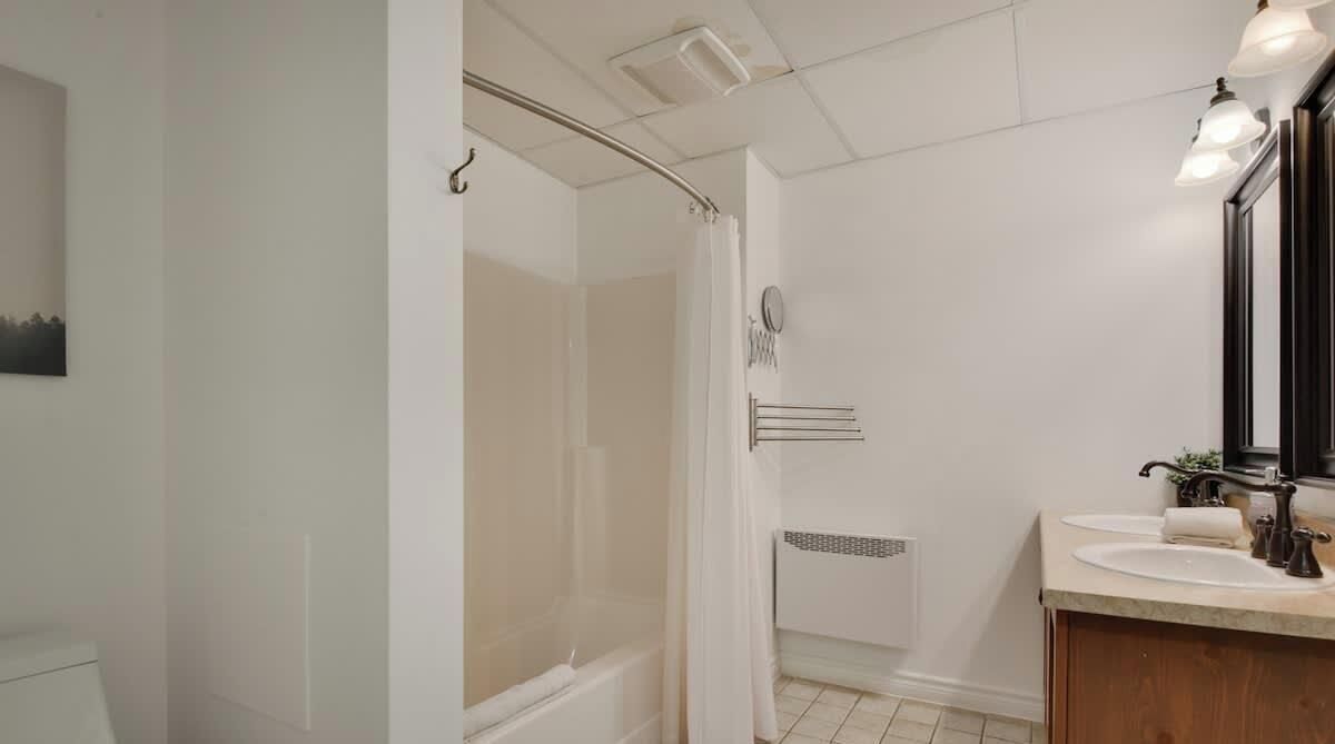 Bathtub, hair dryer, towels