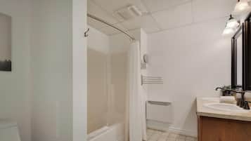 Bathtub, hair dryer, towels