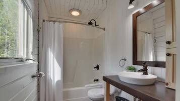 Bathtub, hair dryer, towels