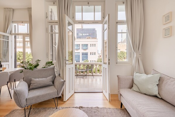 City Apartment, 2 Bedrooms | Living area | 42-inch Smart TV with digital channels, TV, Netflix - OurPlace Rothschild Allenby (Tel Aviv)