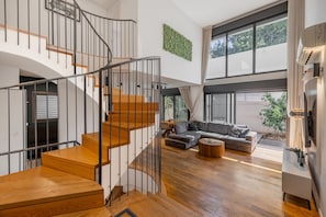 Luxury Apartment | Living area | 42-inch Smart TV with digital channels, TV, Netflix - OurPlace Rothschild Allenby (Tel Aviv)