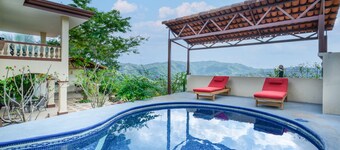 Lovely home near the beach with pool, balcony, mountain view, & full kitchen