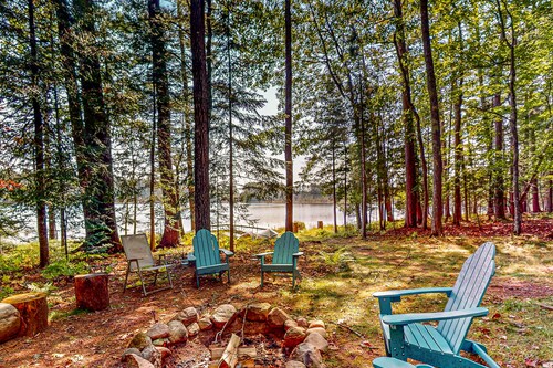 Lakefront, dog-friendly home with canoe, firepit, large deck, & washer/dryer