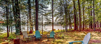 Lakefront, dog-friendly home with canoe, firepit, large deck, & washer/dryer