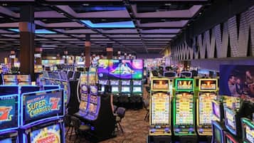 Experience the excitement of the casino floor, where slot machines and video poker machines await.