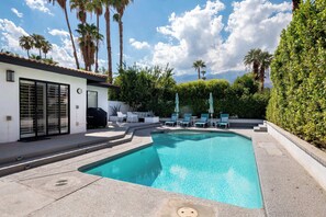 Outdoor pool, pool umbrellas, sun loungers