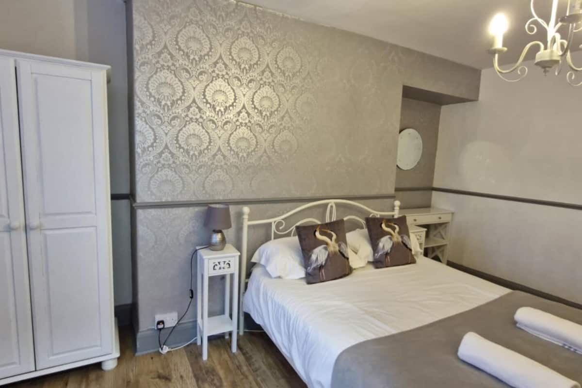 Premium bedding, pillowtop beds, laptop workspace, blackout drapes