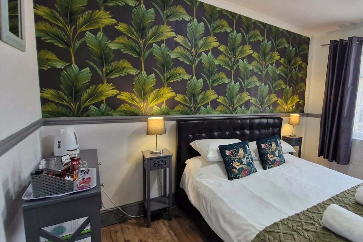 Premium bedding, pillowtop beds, laptop workspace, blackout drapes