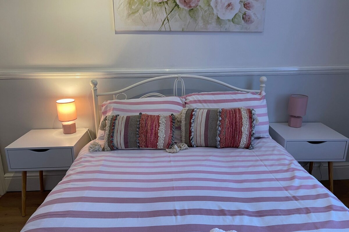Premium bedding, pillow-top beds, laptop workspace, blackout curtains