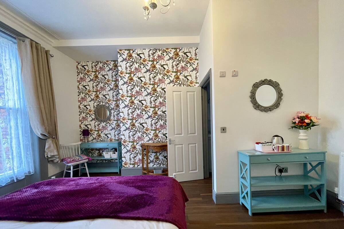 Premium bedding, pillowtop beds, laptop workspace, blackout drapes
