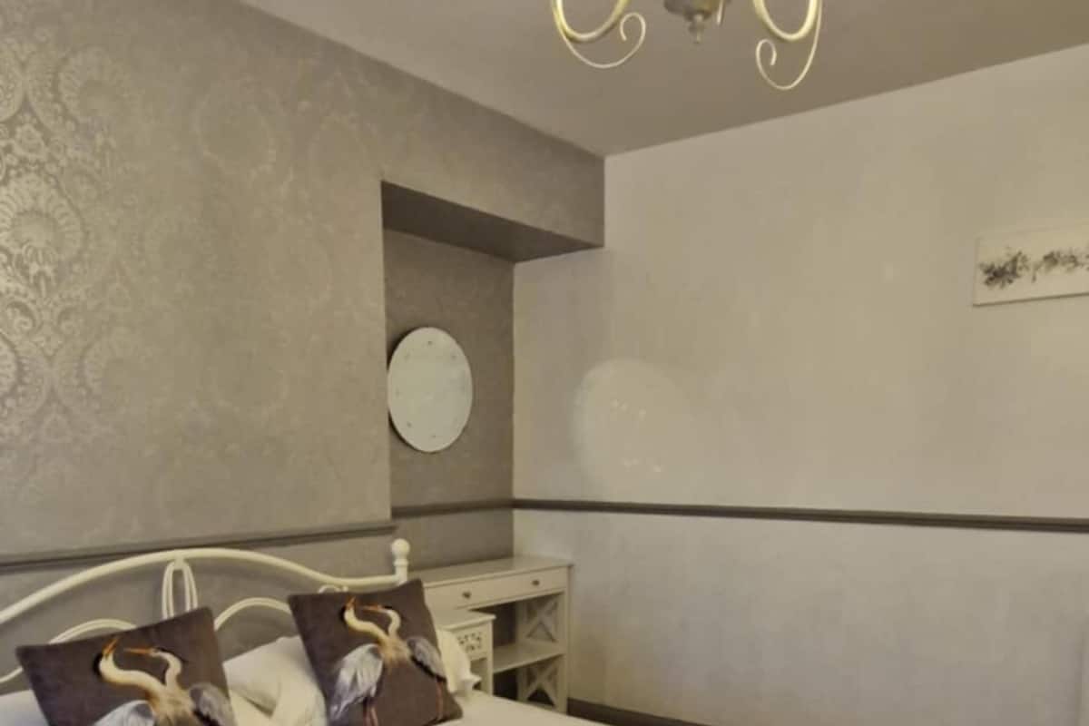 Premium bedding, pillowtop beds, laptop workspace, blackout drapes