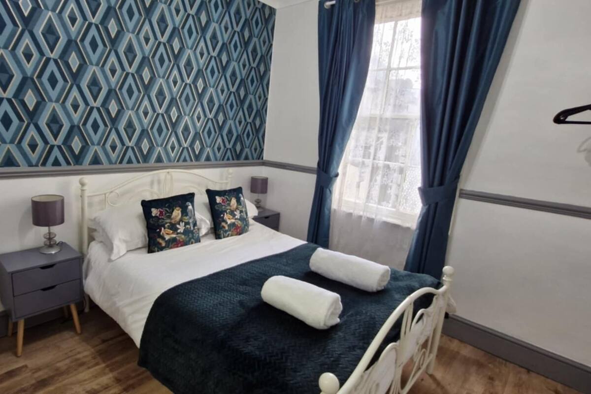 Premium bedding, pillowtop beds, laptop workspace, blackout drapes