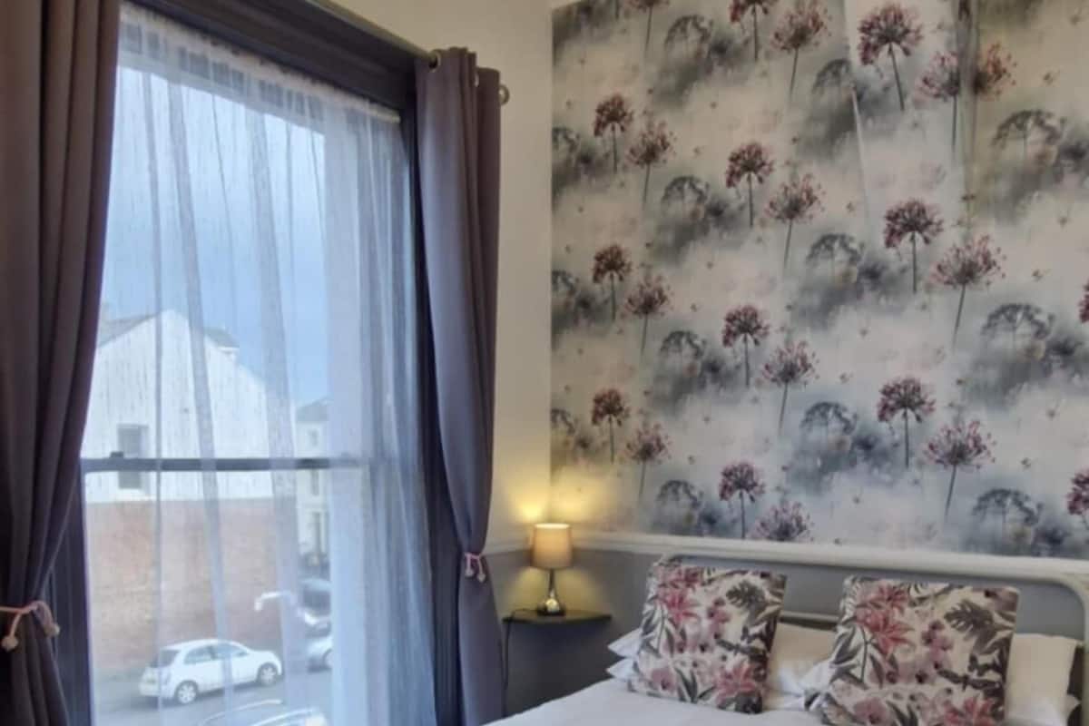 Premium bedding, pillowtop beds, laptop workspace, blackout drapes