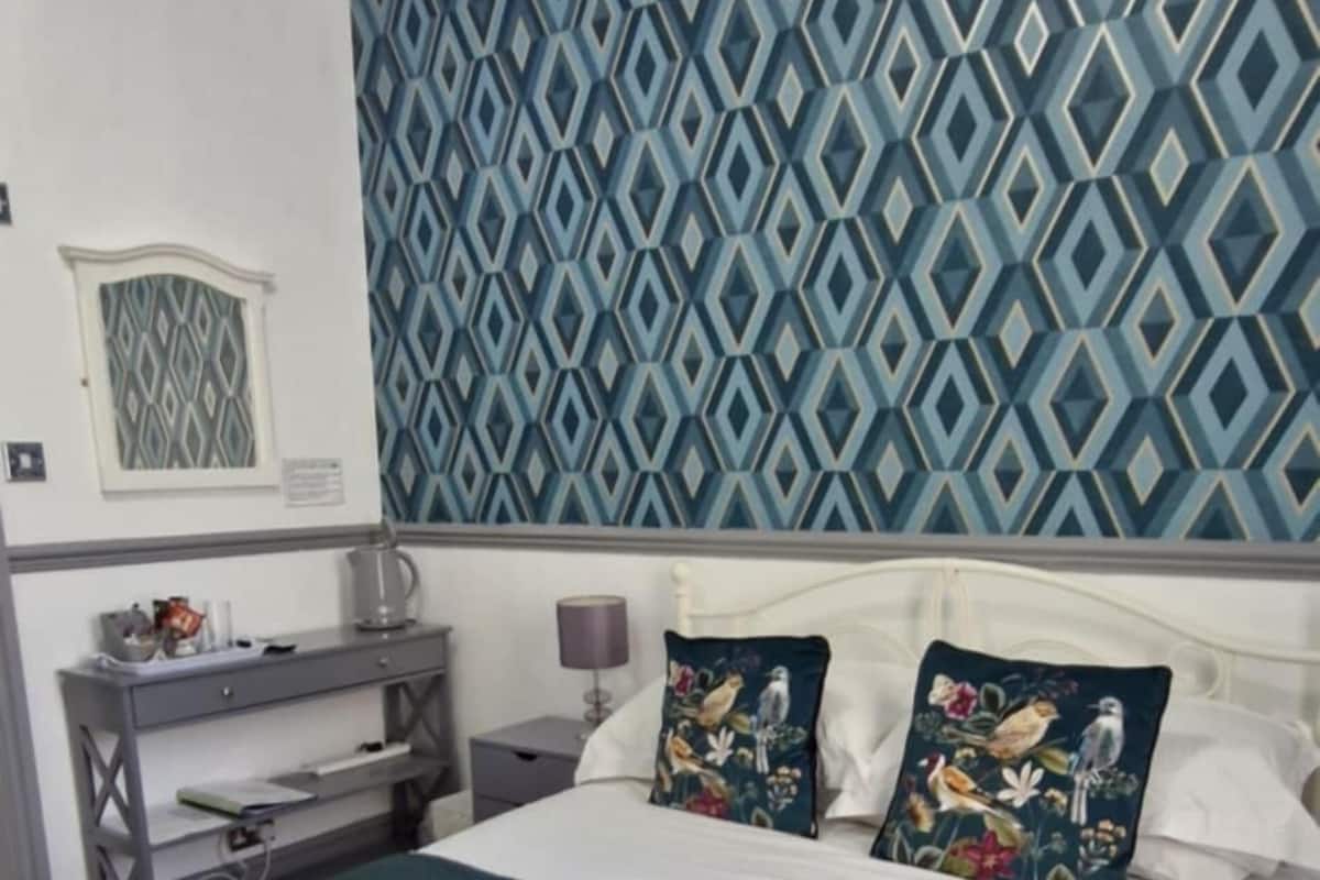 Premium bedding, pillowtop beds, laptop workspace, blackout drapes