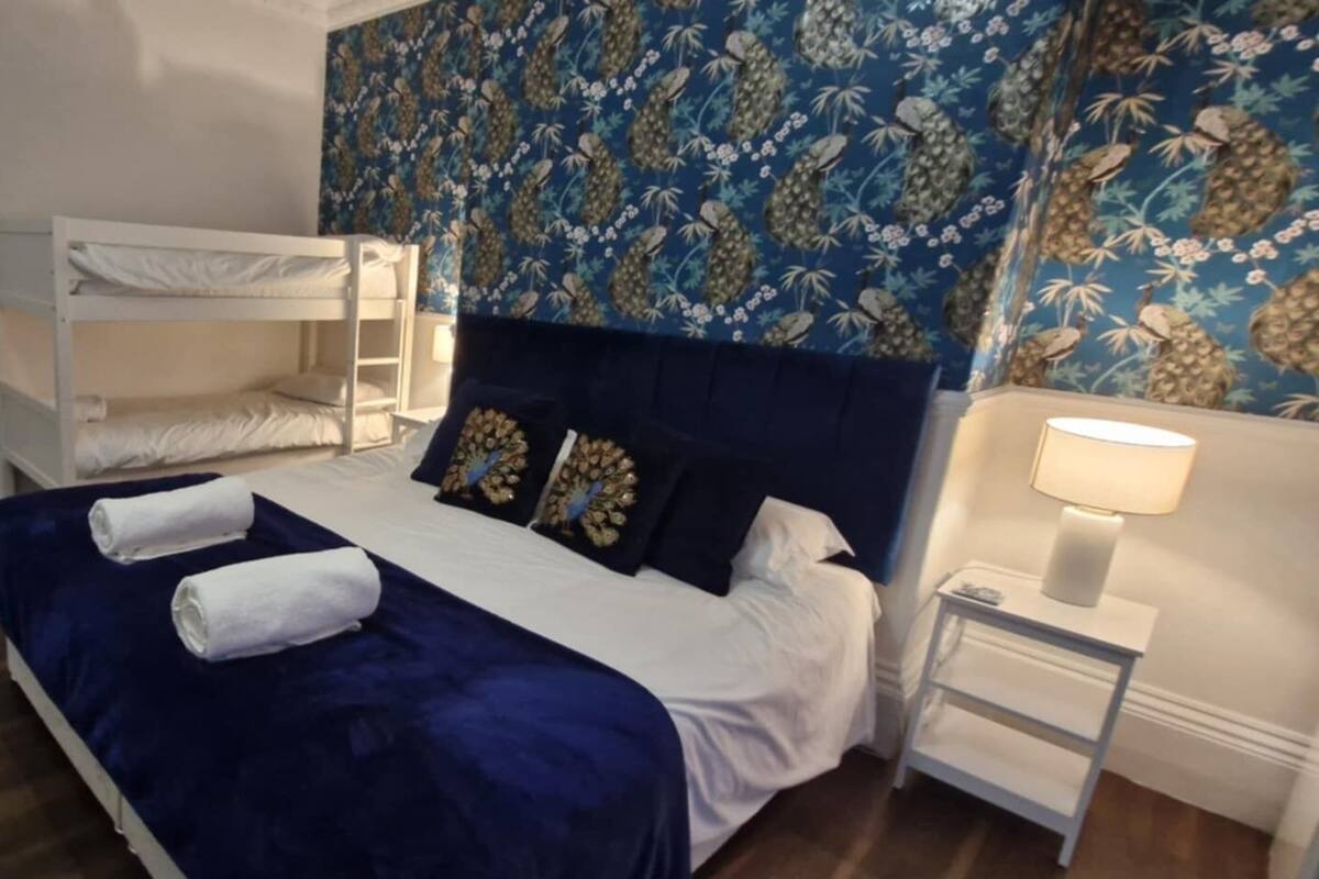Premium bedding, pillowtop beds, laptop workspace, blackout drapes