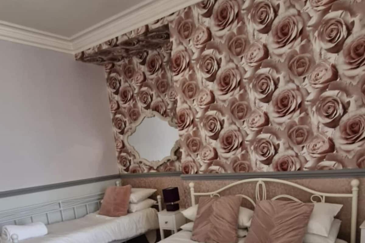 Premium bedding, pillowtop beds, laptop workspace, blackout drapes