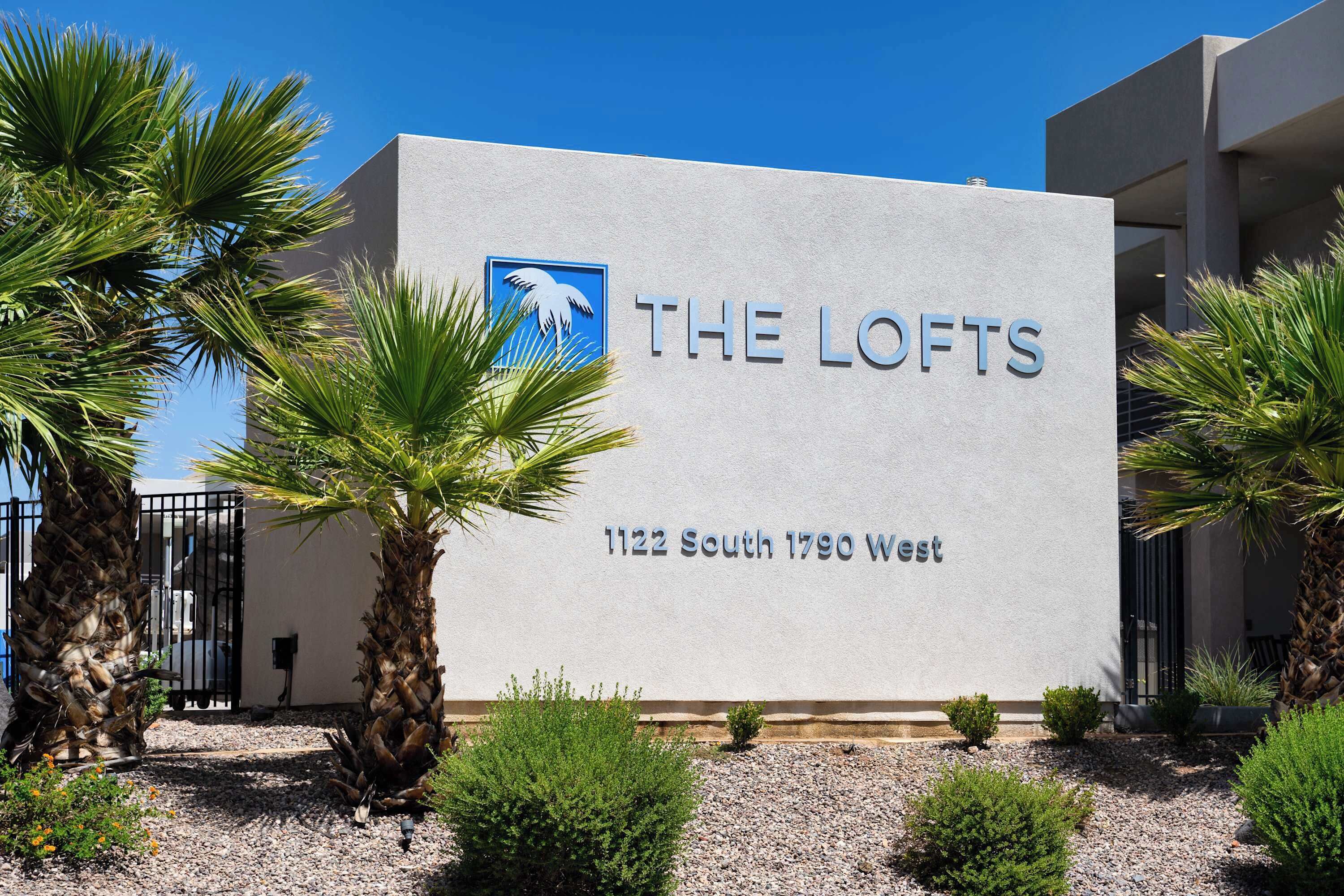 A building with a sign reading 'THE LOFTS' and the address '1122 South 1790 West'.