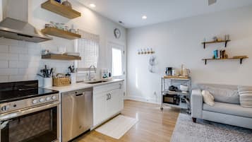Condo, Multiple Beds, Garden View | Private kitchen | Stovetop, dishwasher, coffee/tea maker, cookware/dishes/utensils
