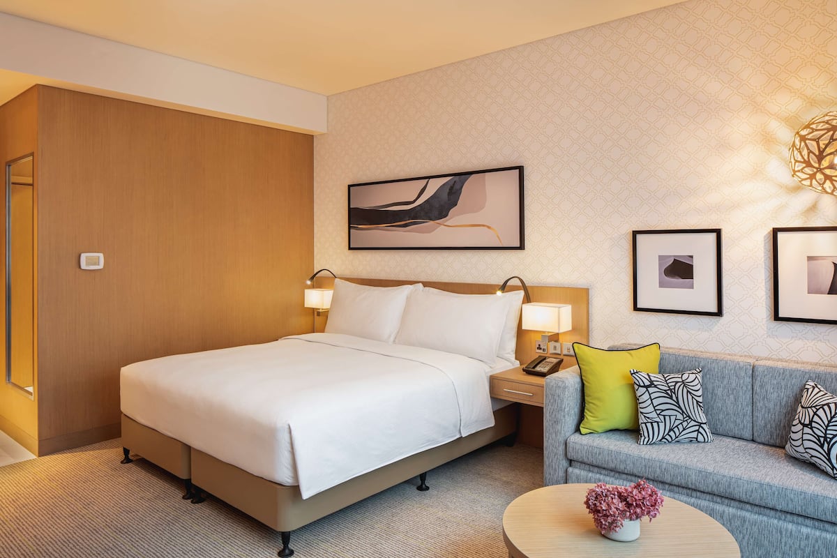 Chambre Deluxe, 1 trÚs grand lit | Coin séjour