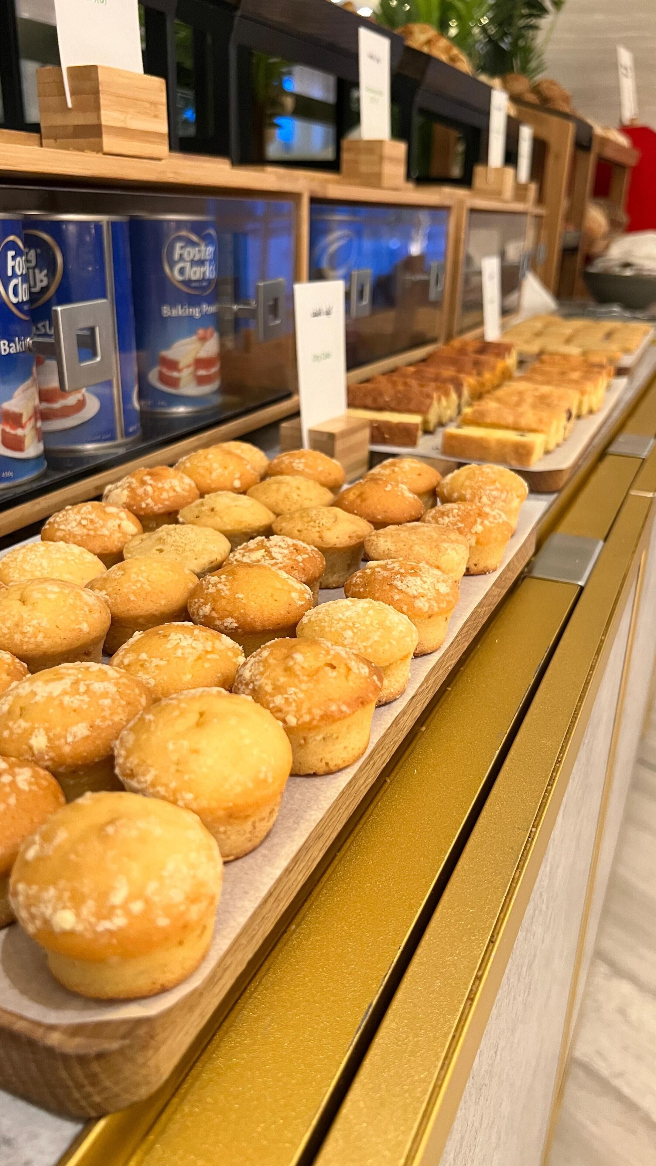A bakery display with various baked goods, including bread and pastries.
